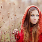 Portrait of beautiful girl with scarf in autumn nature